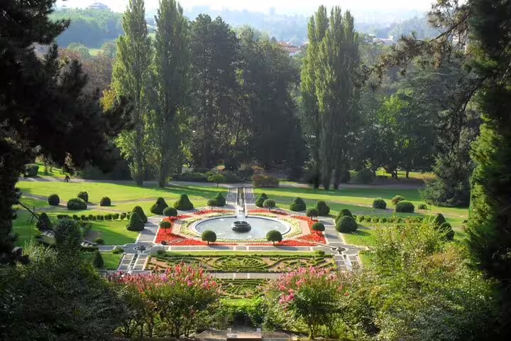 Scenic view of a lush garden with a central fountain in Varese, Italy, ideal for a Milan to Varese private half-day tour.