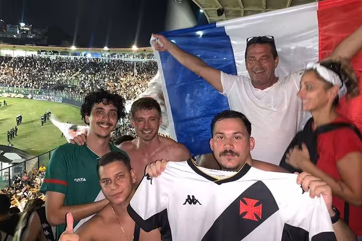 Vasco da Gama fans pose with team jersey and flag in packed São Januário, Rio de Janeiro matchday with local guide