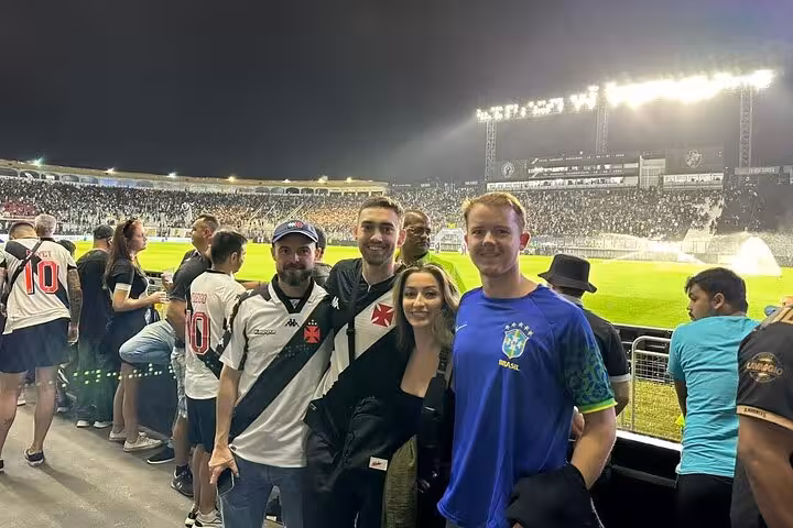 Tour guests with local guide at a Vasco da Gama match in Rio de Janeiro, pitchside at São Januário stadium