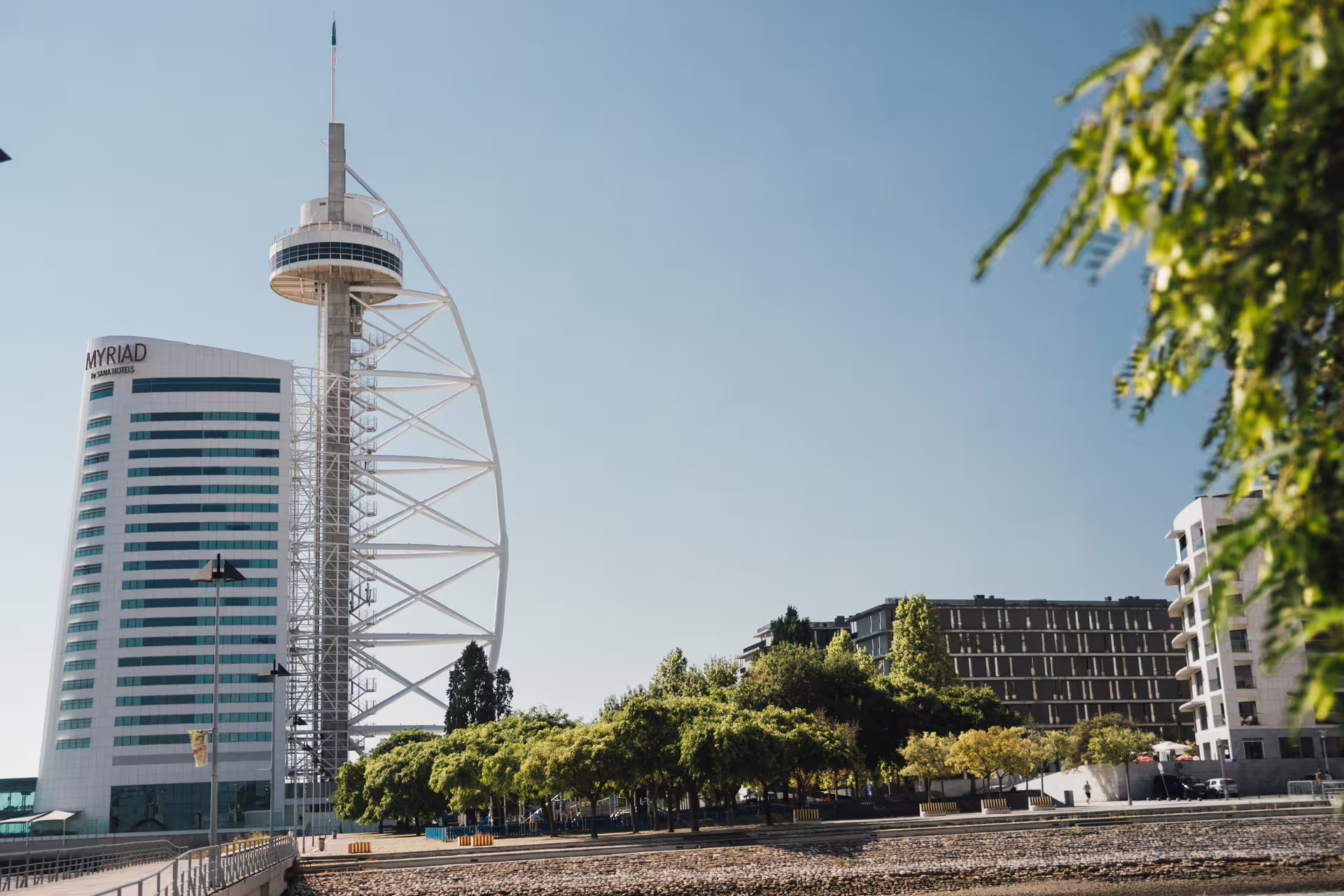 View of the iconic Vasco da Gama Tower and surrounding architecture in Lisbon's Parque das Nações district.