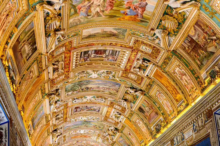 Golden vaulted ceiling of the Gallery of Maps in the Vatican Museums, visited on Rome hop on hop off bus and Sistine Chapel tour