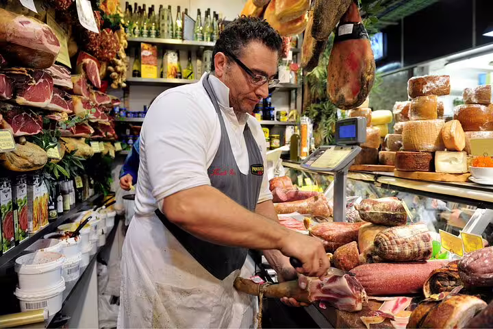 A skilled artisan prepares cured meats in a bustling Vatican market, surrounded by traditional Italian cheeses and products.