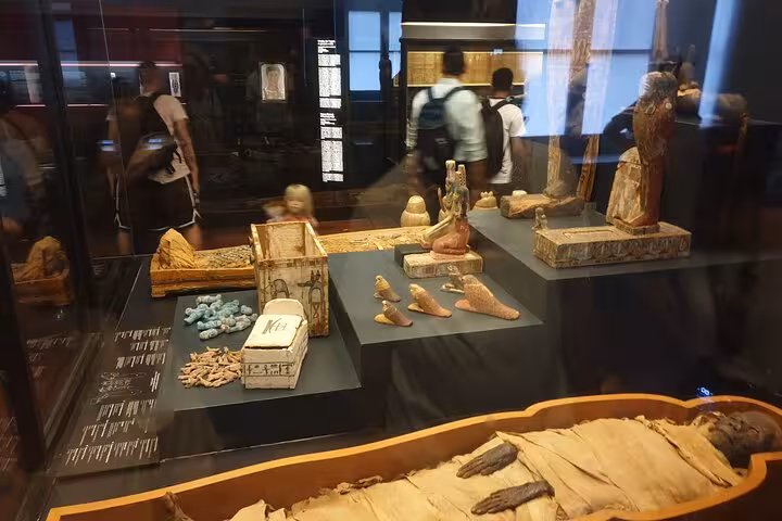 Artifacts and mummies displayed in the Vatican Museum showcase the richness of ancient cultures for tourists.