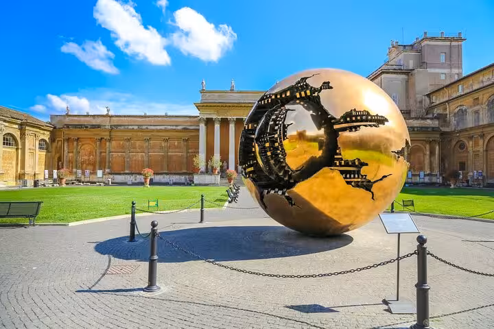 Explore the Vatican Museum courtyard featuring Arnaldo Pomodoro's Sphere Within Sphere sculpture on our guided tour.