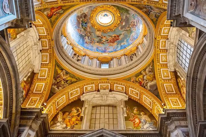Stunning frescoed dome interior in Vatican Museum on fast track guided tour, showcasing intricate Renaissance art.