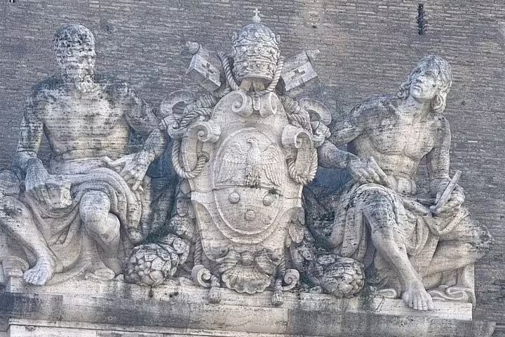 Stone relief with papal coat of arms on Vatican Museums exterior wall, ideal for Vatican Museum & Sistine Chapel ticket