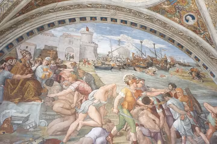 Intricate Renaissance fresco depicting historical scenes adorns the Vatican Museum's walls.