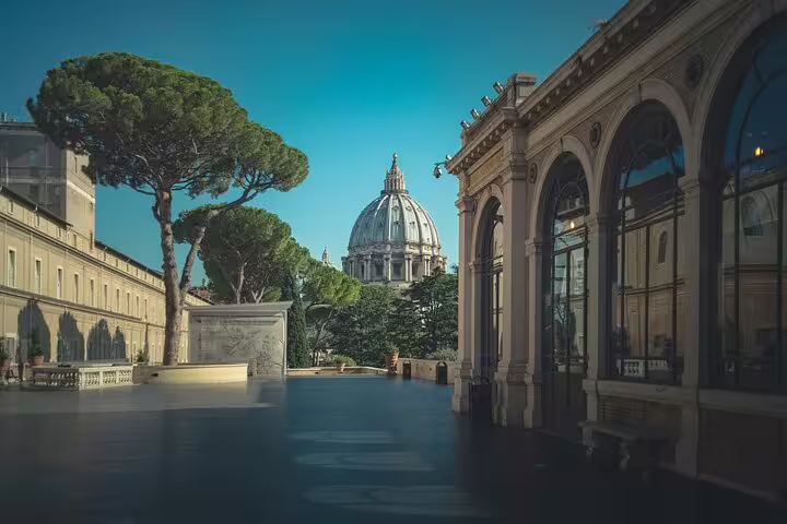 Vatican Museums courtyard view with St Peter’s Basilica dome, ideal for Vatican Museum entry ticket tour