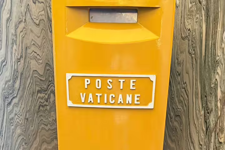 Yellow Poste Vaticane mailbox in Vatican City, near Vatican Museums and Sistine Chapel entrance for ticket holders