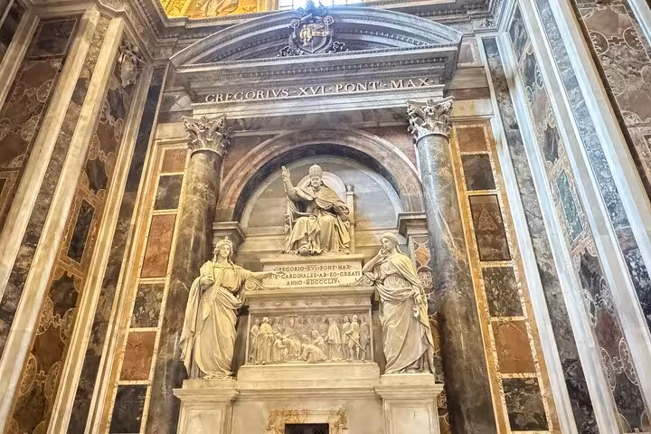 Intricate marble sculpture inside Vatican St Peter's Basilica on a small group private tour.