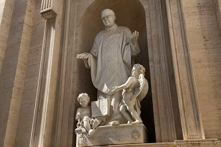 Statue of a religious figure with cherubs at St. Peter's Basilica, featured on a Vatican private tour.
