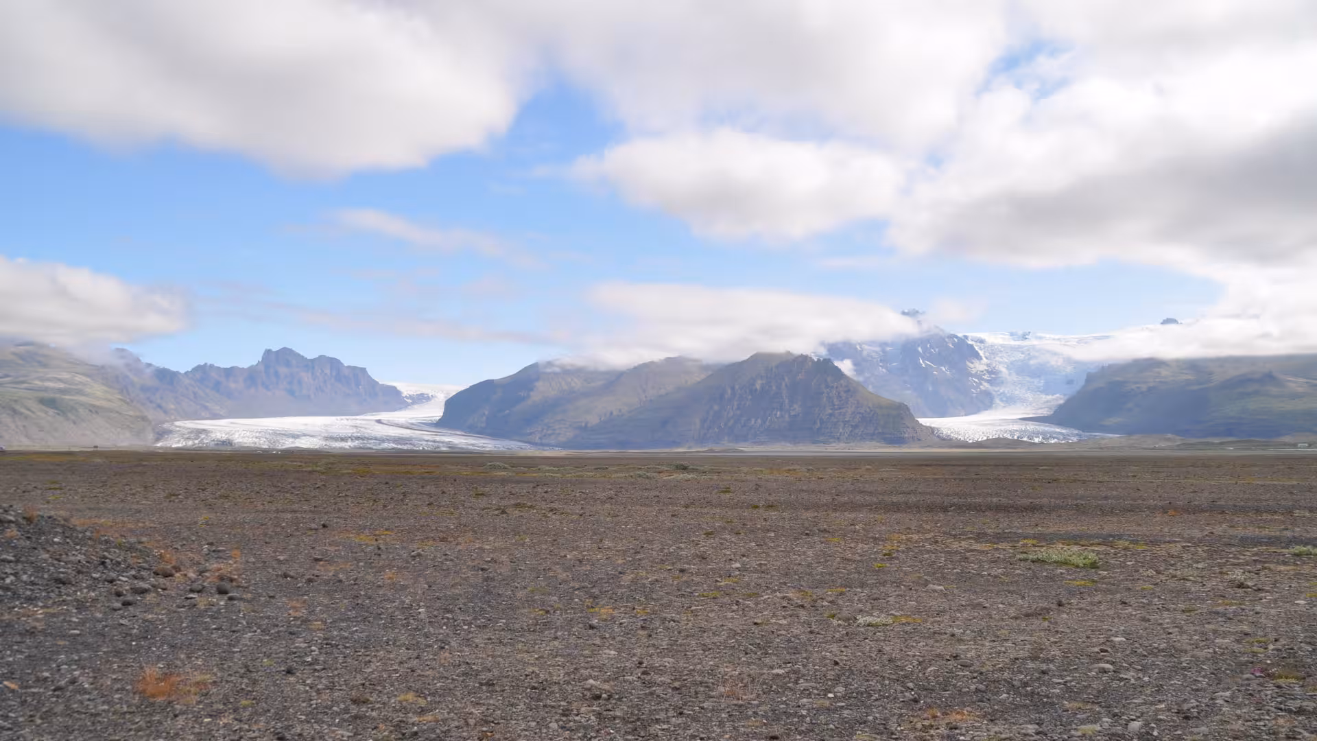 Wide view of Vatnajokull glacier and black sand plains near Jokulsarlon on a private rally car adventure