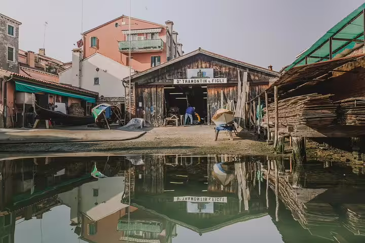 Traditional Venetian boatyard with gondolas in the making, featured on the Venice deluxe heritage tour.