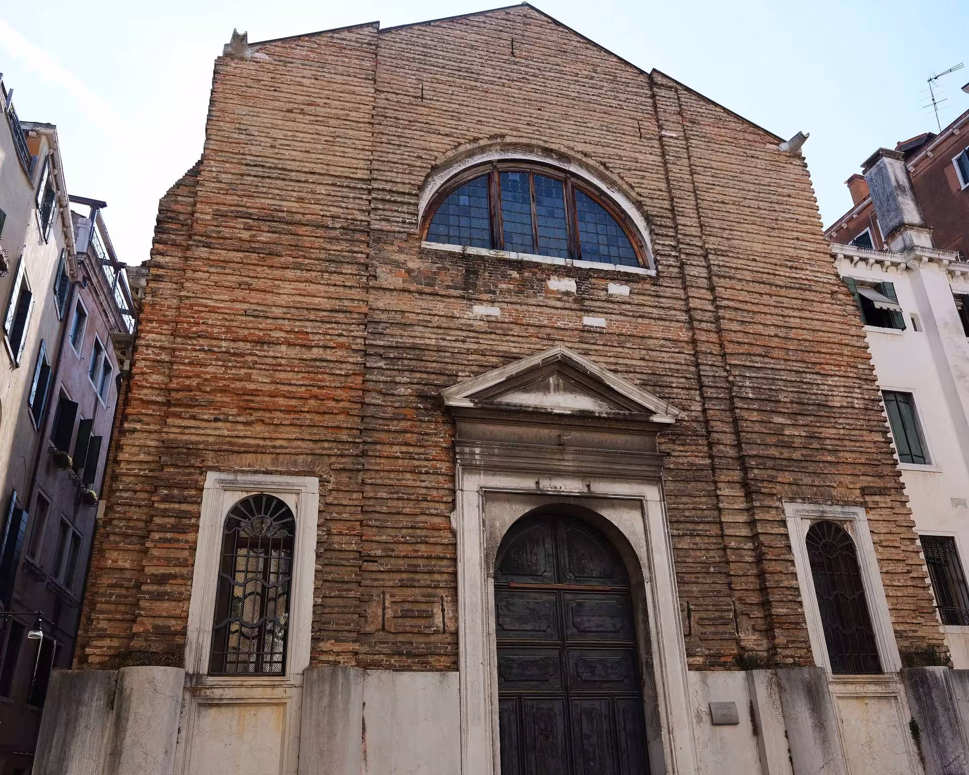 Historic brick facade of a Venetian building featured on the San Marco to Rialto walking tour.