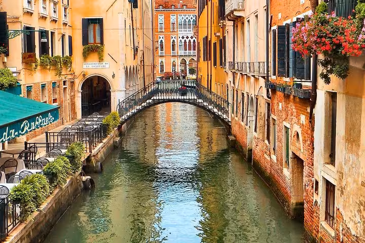 Discover Venice's charming canals and quaint bridges, perfect for a scenic stroll on our express walking tour.