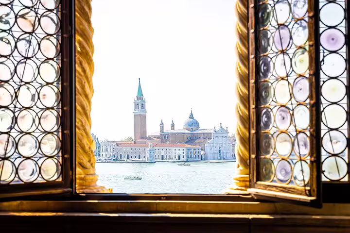 Romantic window view of San Giorgio Maggiore island and domes across the lagoon on a last minute Venice private tour