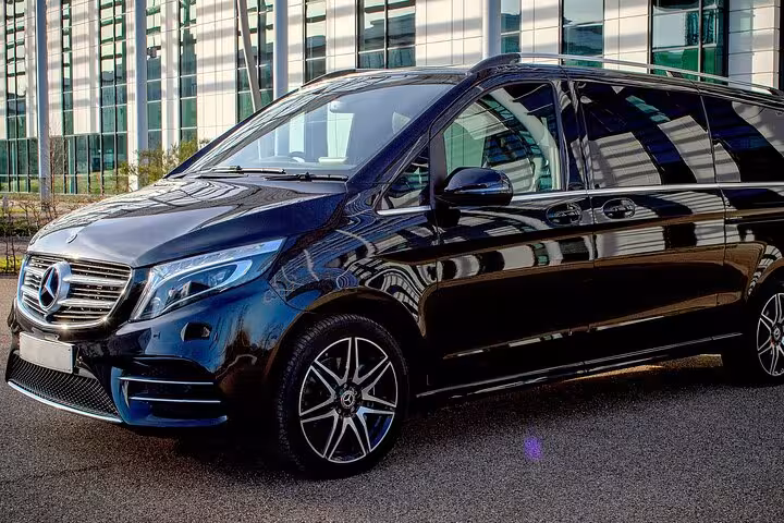 Luxurious black Mercedes van ready for private transfer service from Venice to Trieste Port for cruise passengers.