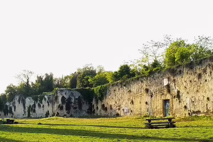 Scenic Verona hillside park with historic fortress walls and benches, featured on the guided walking tour