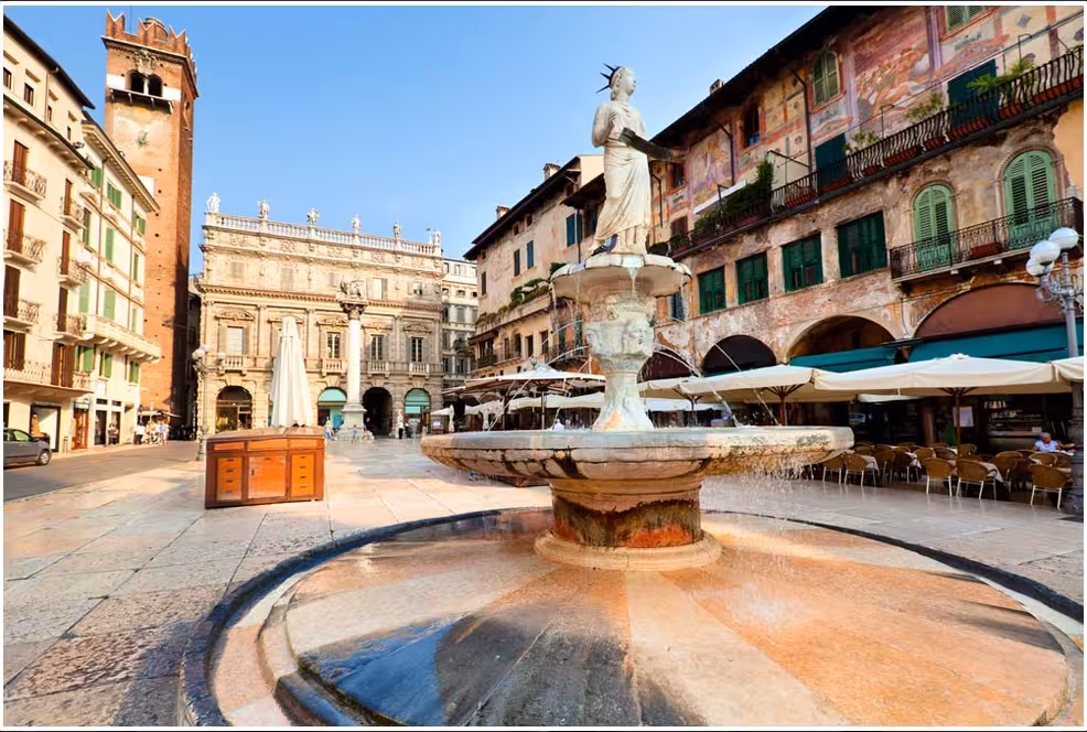 Historic Verona square with a beautiful fountain and elegant architecture, a highlight of the Milan day tour.