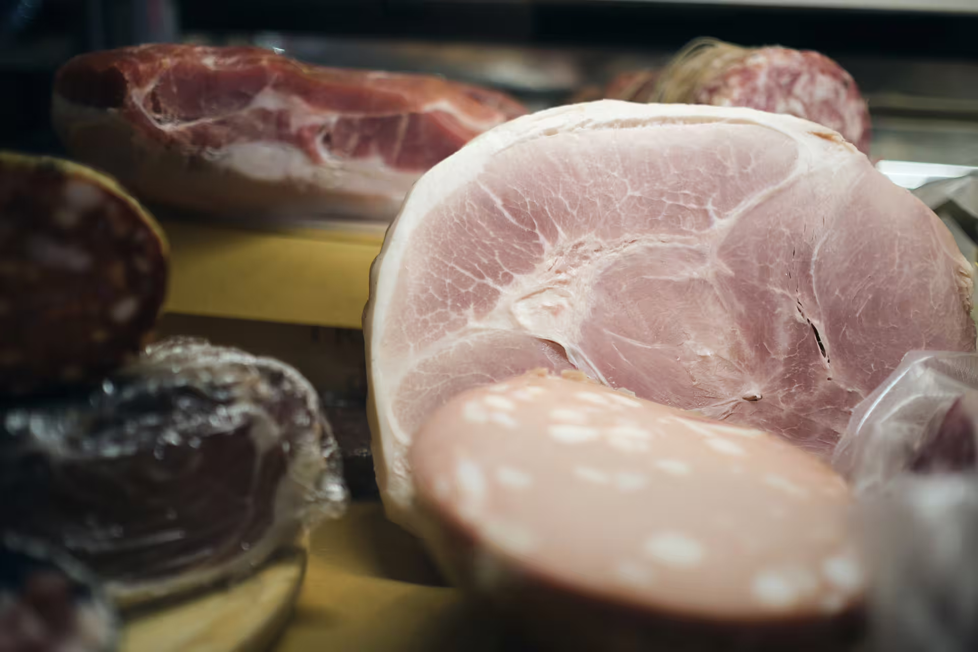 Close-up of cured prosciutto and salami at a Verona deli stop on a guided food tour with wine tasting