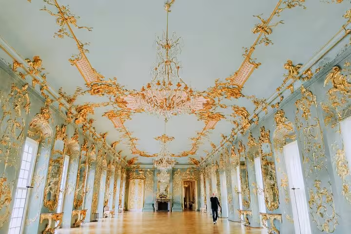 Versailles Grand Tour guided palace visit inside the gilded Hall of Mirrors-style gallery with chandeliers