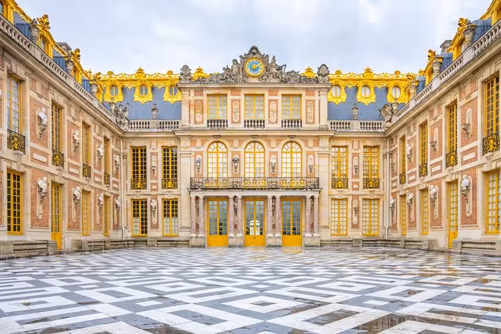 Versailles Palace Marble Court facade with gold details, ideal photo stop on guided grand tour experience