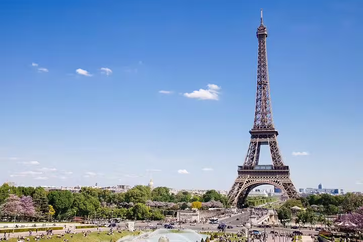 Eiffel Tower panorama in Paris, iconic landmark seen during Versailles private two-way transfer with driver
