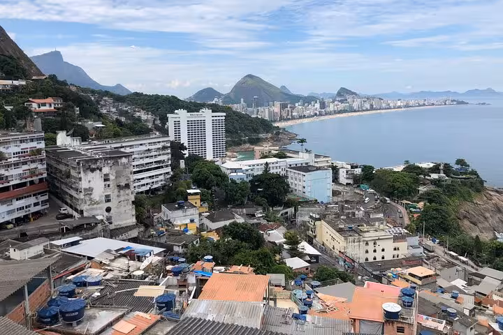 Panoramic vista from Vidigal, showcasing urban landscape and ocean views, ideal for a private walking tour.