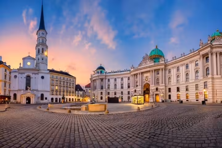 Vienna Hofburg Palace and Michaelerplatz at sunset, start of a Vienna to Munich private transfer via Salzburg