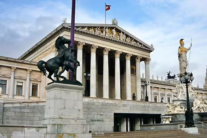 Explore Vienna's rich history with a private half-day tour featuring the iconic Austrian Parliament Building and Athena Fountain.