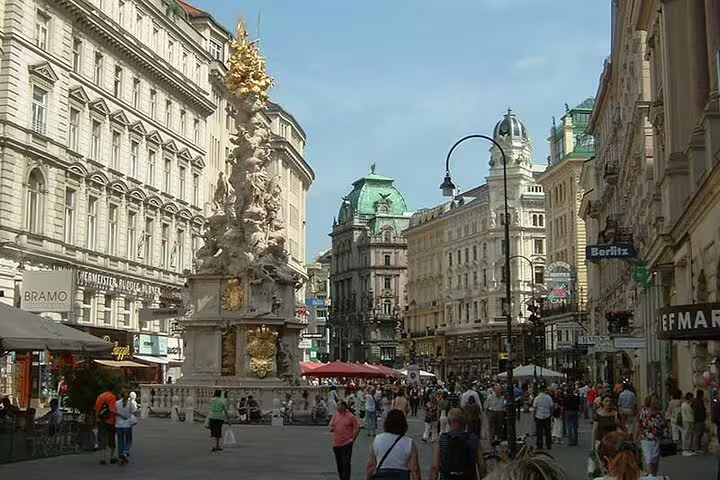 Vienna city center street with ornate plague column, ideal for a self-guided e-scavenger hunt tour