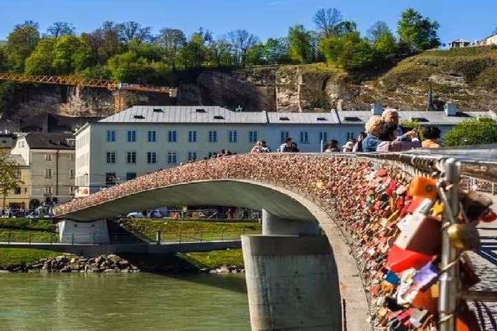 Love lock bridge over the Salzach River in Salzburg, scenic stop on Vienna to Salzburg private transfer