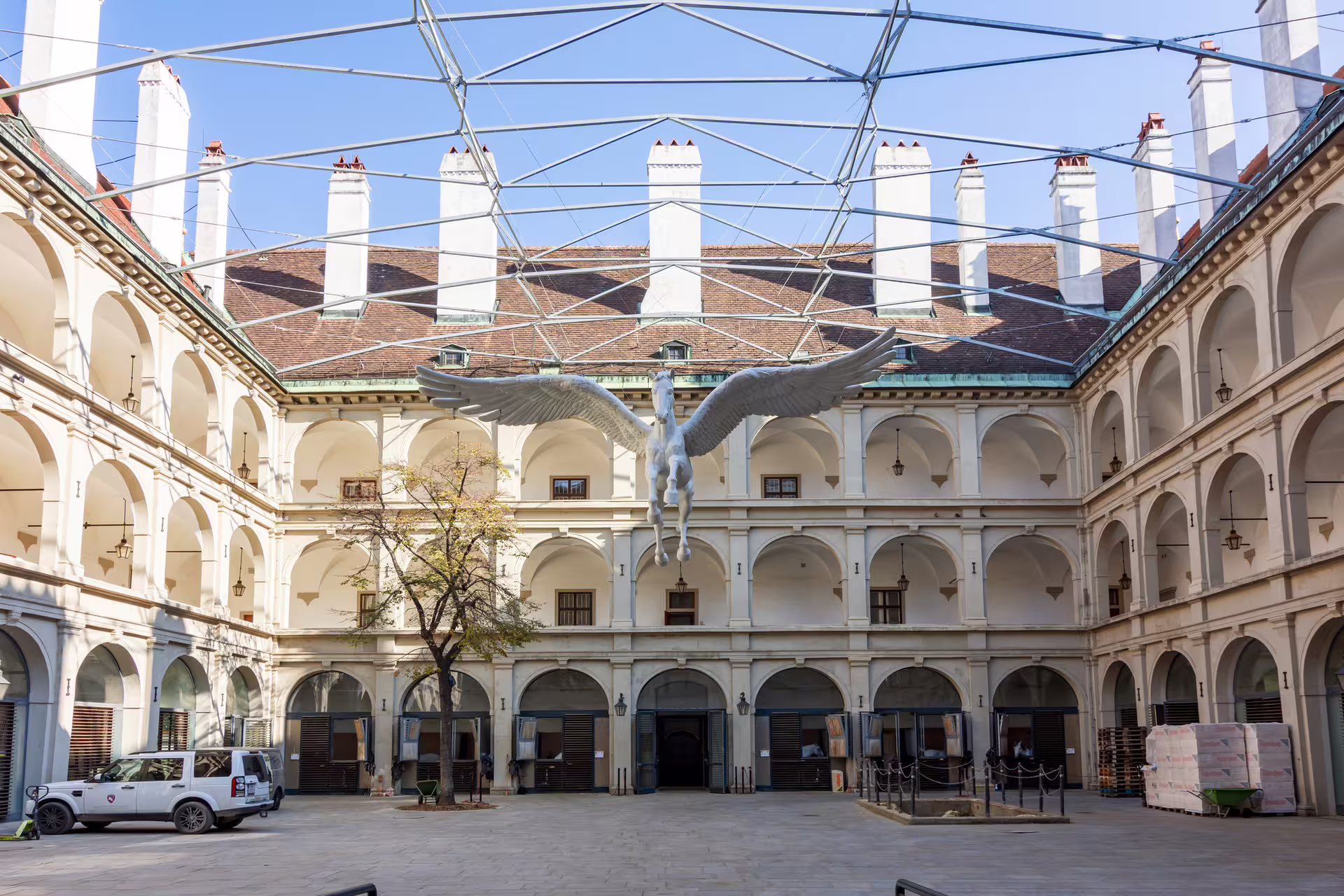 Courtyard with winged Pegasus at Vienna Spanish Riding School, ideal stop on 1-day heritage walking audioguide