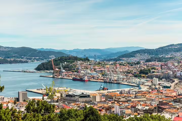 Panoramic view of Vigo's harbor and cityscape, a picturesque stop on the Porto to Santiago Compostela journey.