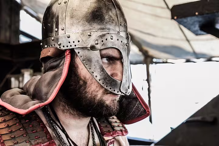 Viking reenactor in traditional armor aboard a cruise ship, offering an immersive historical experience.