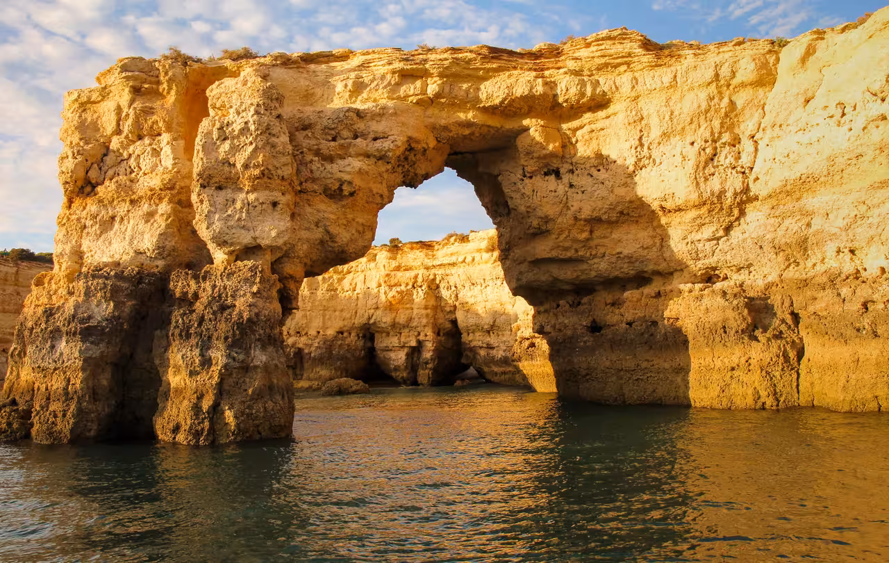 Breathtaking natural rock arch along the Algarve coastline seen on a full-day private boat tour from Vilamoura