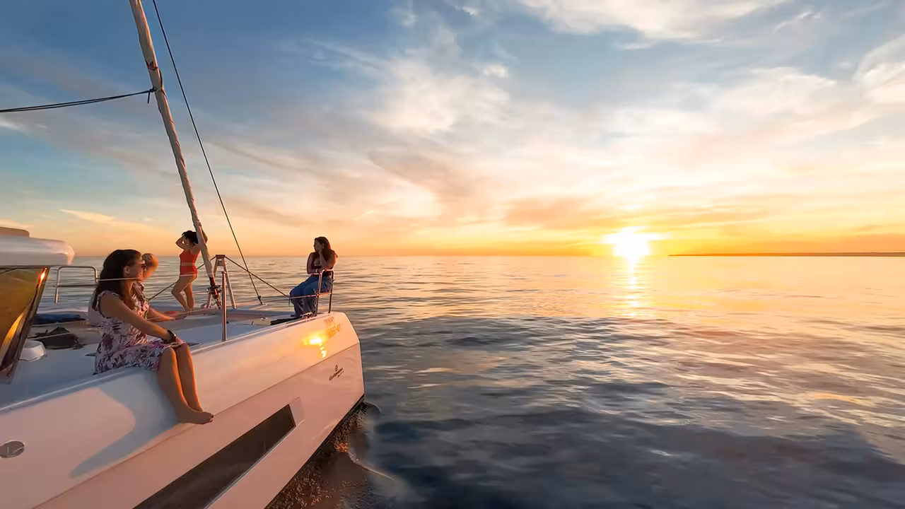 Guests relaxing on a catamaran deck during a private sunset cruise in Vilamoura Algarve Portugal