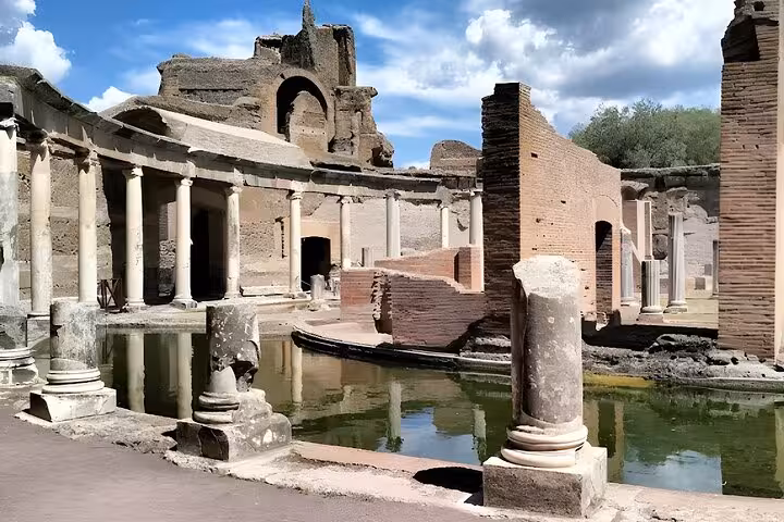 Explore ancient Roman architecture with a half-day tour of Villa Adriana featuring stunning ruins and reflective pools.