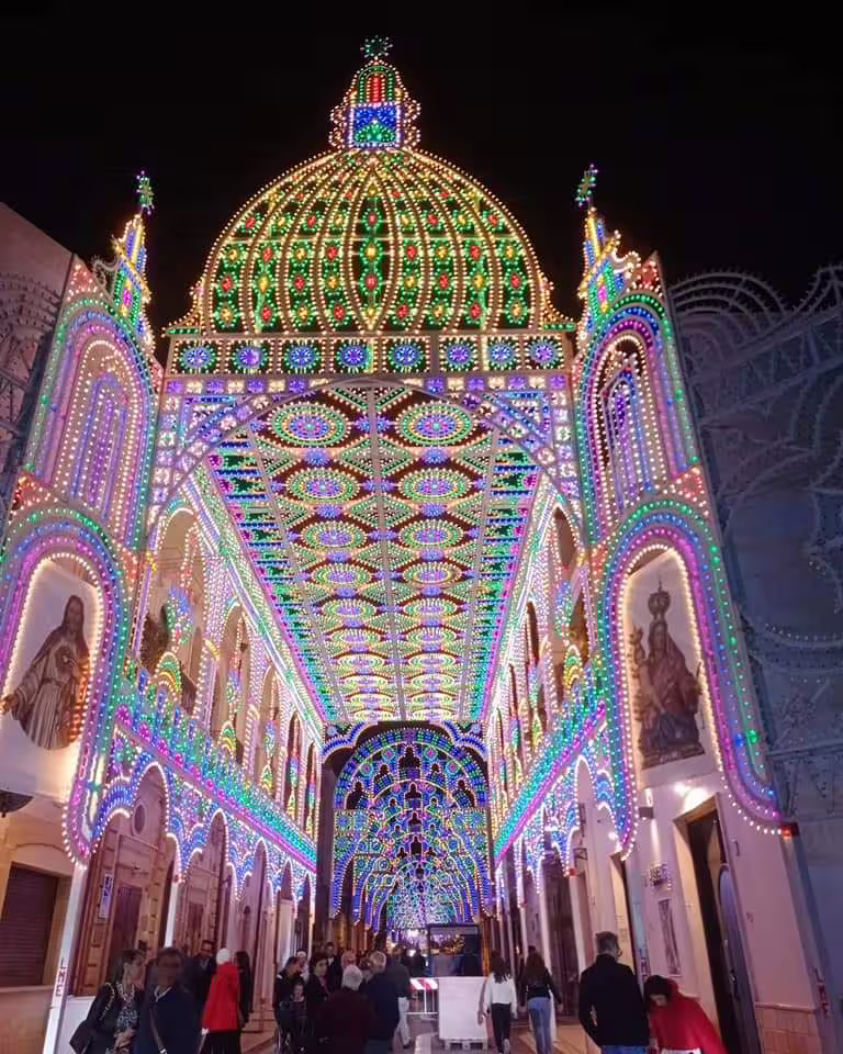 Colorful festival light tunnel in Villa Castelli, seen on the highlights walking tour before the olive oil tasting
