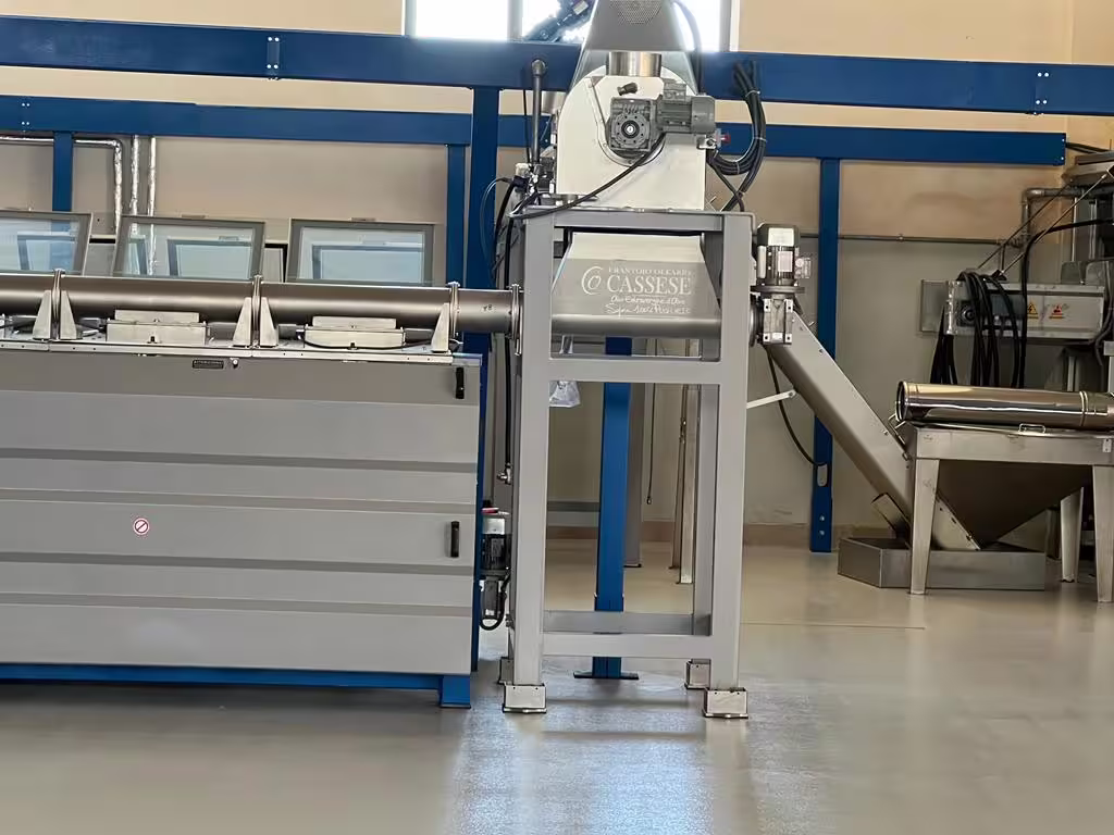 Modern olive oil mill machinery in Villa Castelli, featured during the walking tour highlights and olive oil tasting