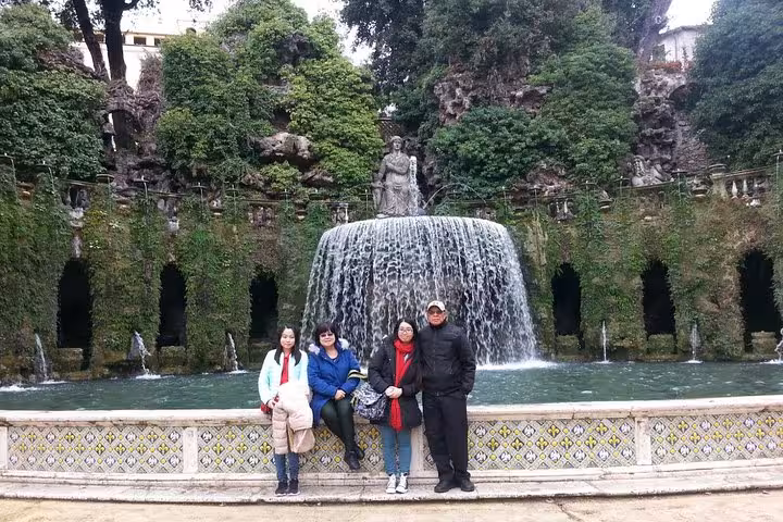 Travelers at Villa d’Este Tivoli waterfall fountain on a half-day tour from Rome, Italy garden highlight