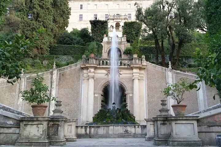 Elegant fountain in Villa d'Este gardens, Tivoli, showcasing Renaissance architecture on a day trip from Rome.