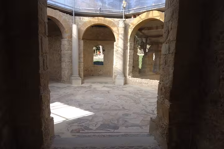 Explore the intricate mosaics and ancient architecture of Villa Romana del Casale in Piazza Armerina, Sicily.