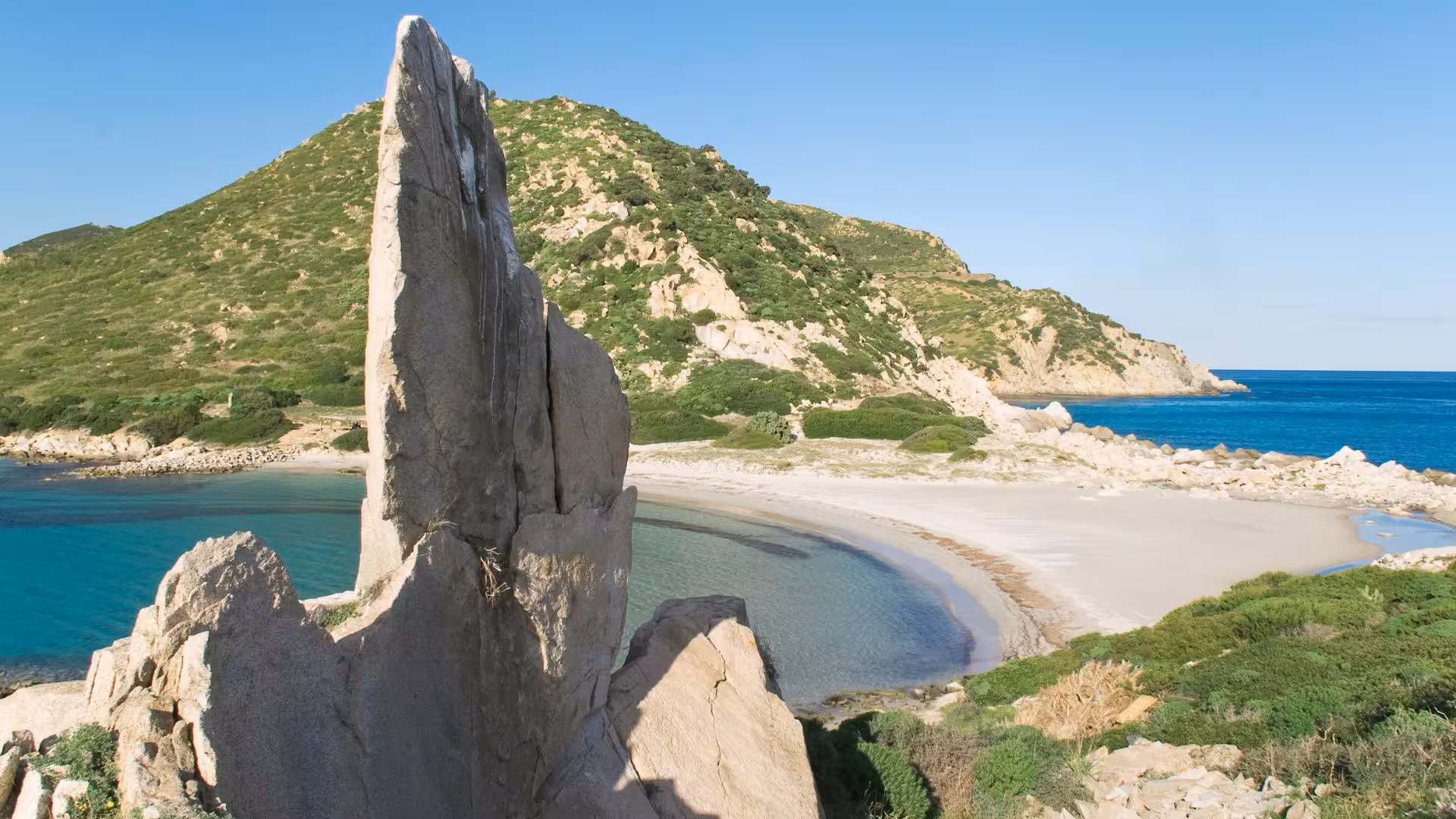 Majestic rock formations and serene beaches of Villasimius, a highlight of Cagliari's coastal tours.