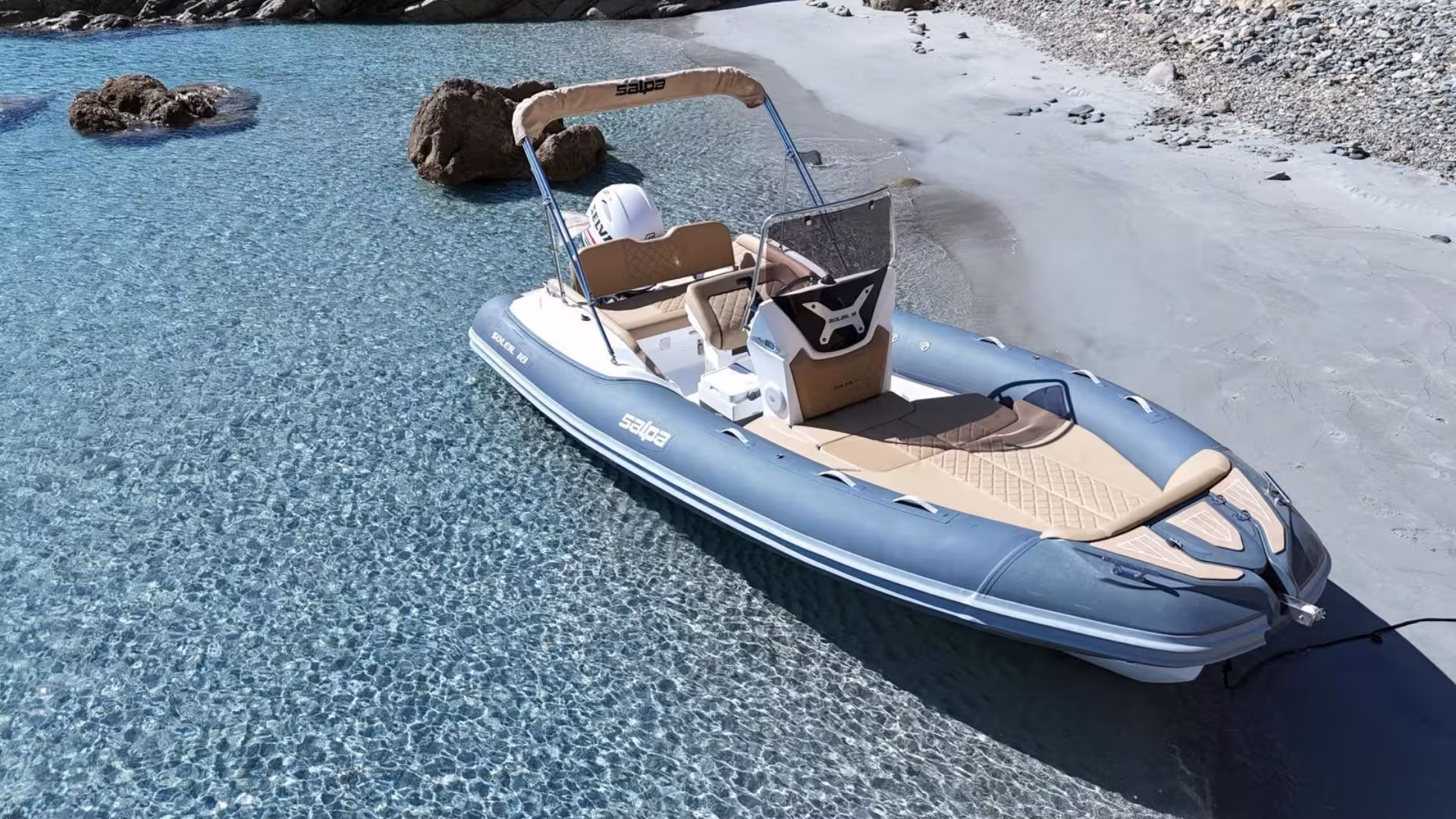 Private dinghy resting on pristine sand with clear blue waters in Villasimius, ideal for a 4-hour coastal exploration.