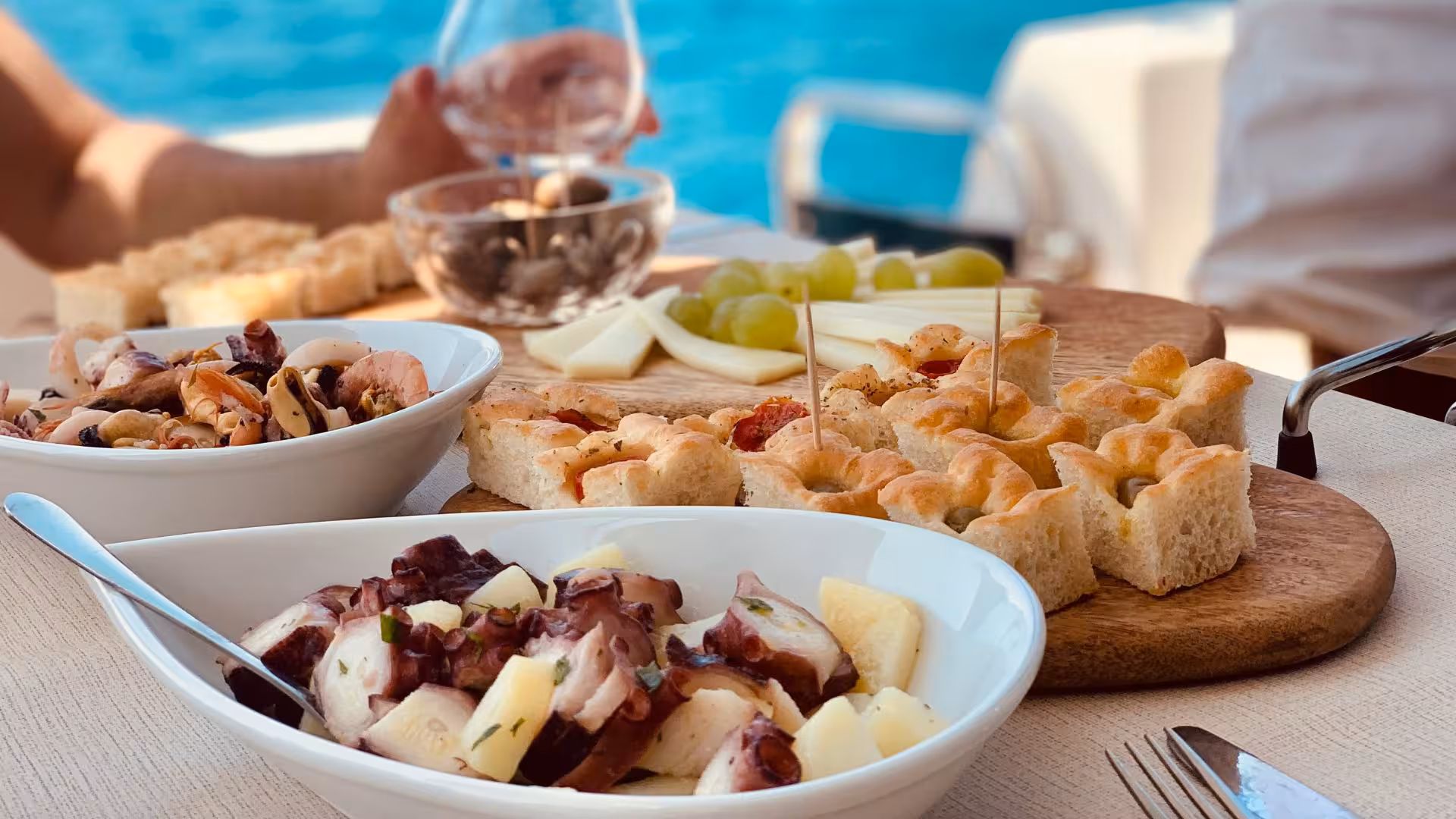 Enjoy fresh seafood and local delicacies aboard a private yacht tour in Villasimius, surrounded by stunning blue waters.
