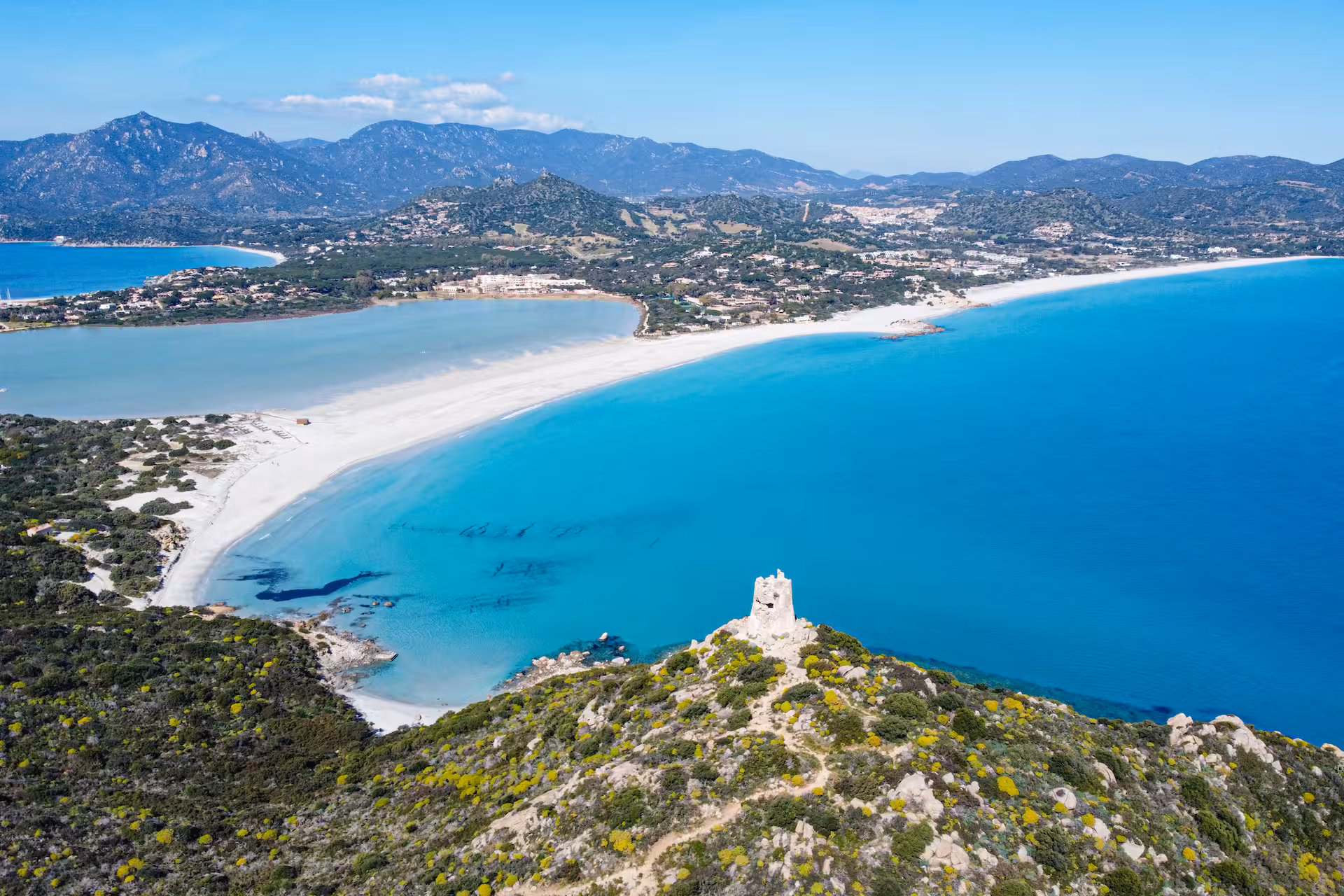 Panoramic view of Villasimius coastline with sandy beaches and turquoise waters, showcasing a perfect snorkeling spot.
