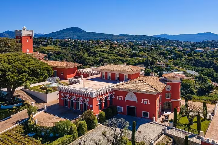 Charming red estate with terracotta roofs in scenic Villefranche sur Mer, ideal for a Nice City private tour.