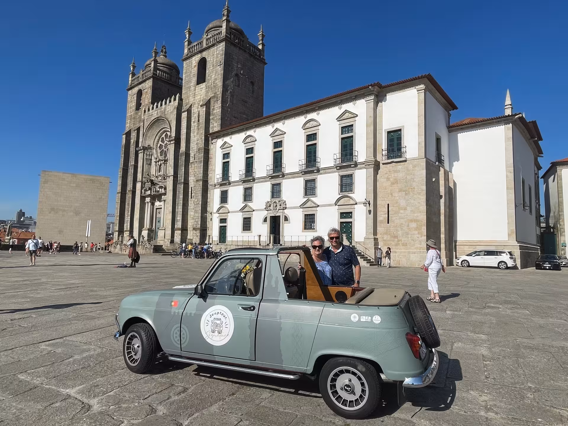Vintage car parked at Porto Cathedral Sé do Porto, classic Porto and Douro tour through historic city landmarks