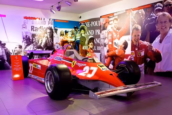 Vintage Ferrari race car showcased in the Ferrari Museum, part of the exclusive Maranello tour experience from Florence.